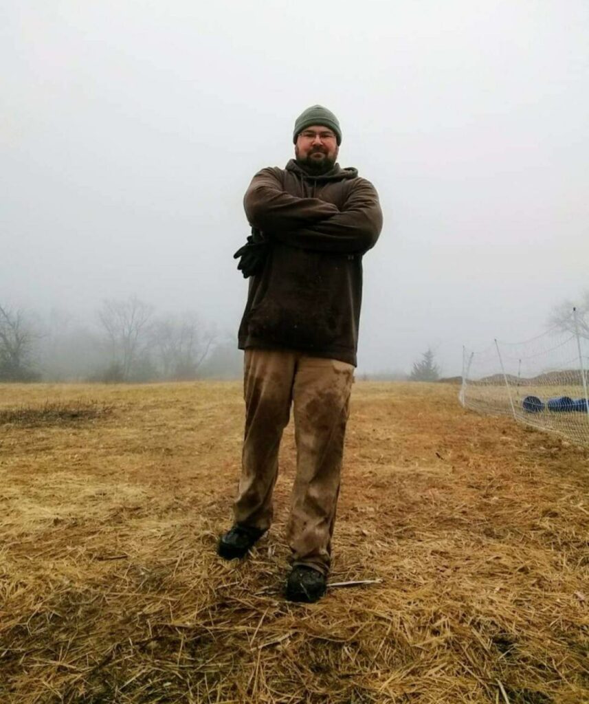 farmer joe villines standing on the farm in the fog