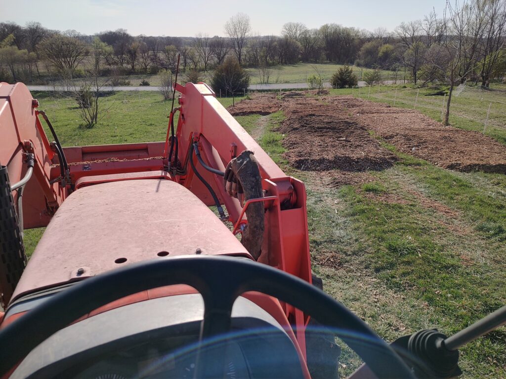 view of mulch in field from sitting on a tractor